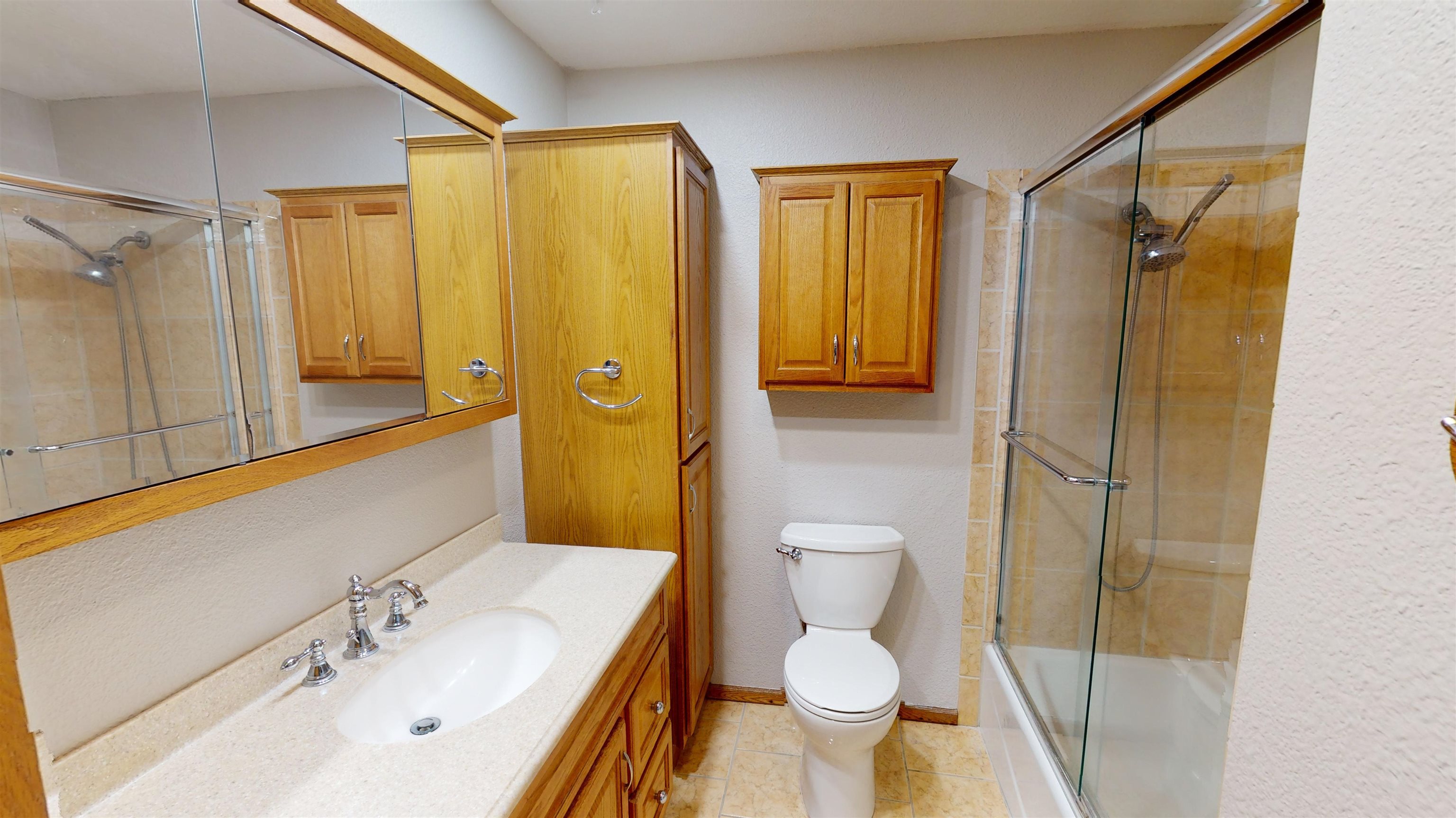 449 Doris Road Grand Junction, CO 81504 - Photo 17 of 35 a bathroom with a sink a toilet and shower