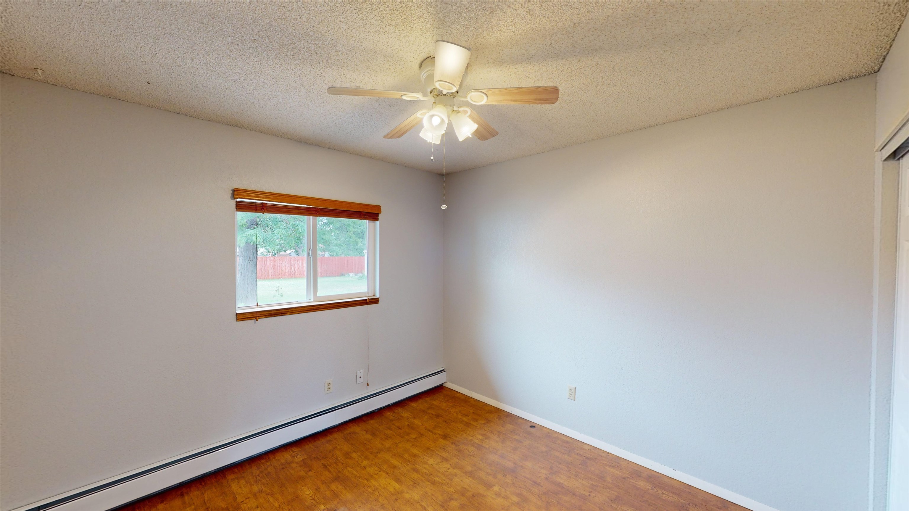 449 Doris Road Grand Junction, CO 81504 - Photo 22 of 35 an empty room with a window and a ceiling fan