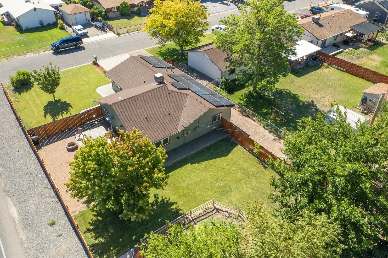 449 Doris Road Grand Junction, CO 81504 - Photo 27 of 35 an aerial view of a house with a garden and swimming pool