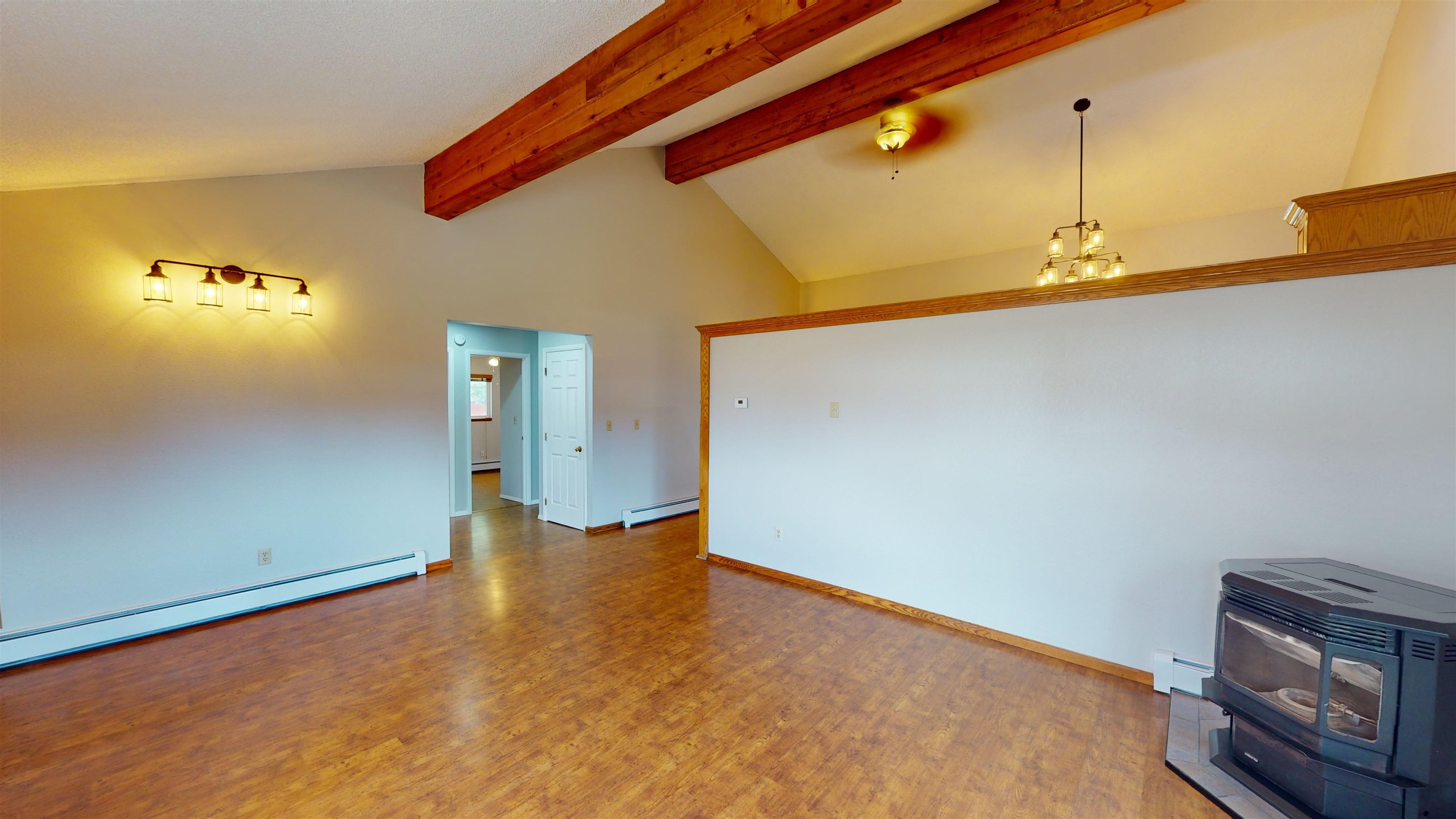449 Doris Road Grand Junction, CO 81504 - Photo 3 of 35 a view of an empty room with wooden floor