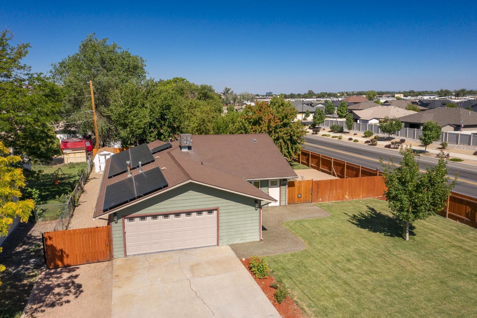 449 Doris Road Grand Junction, CO 81504 - Photo 31 of 35 an aerial view of residential houses with outdoor space and trees