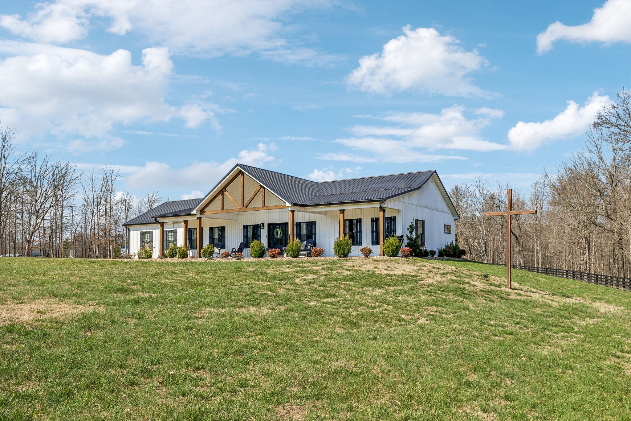 1869 Taurus Farm Road Lafayette, TN 37083 - Photo 1 of 60 a front view of a house with a garden