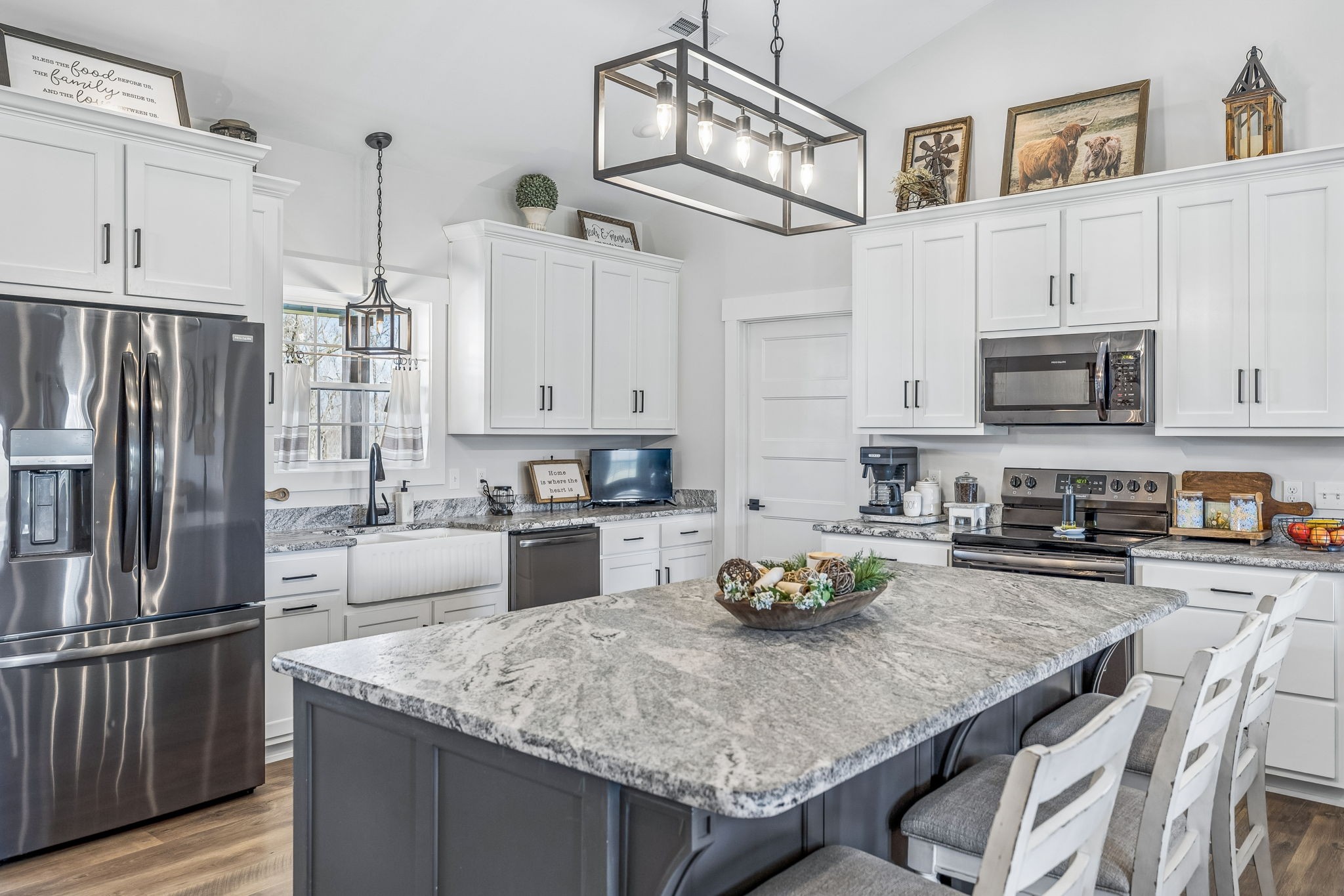 1869 Taurus Farm Road Lafayette, TN 37083 - Photo 15 of 60 a kitchen with kitchen island granite countertop a sink counter top space appliances and cabinets