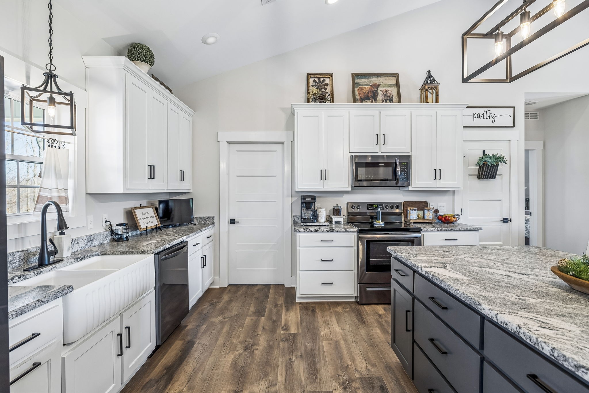 1869 Taurus Farm Road Lafayette, TN 37083 - Photo 17 of 60 a kitchen with granite countertop a sink stove and cabinets