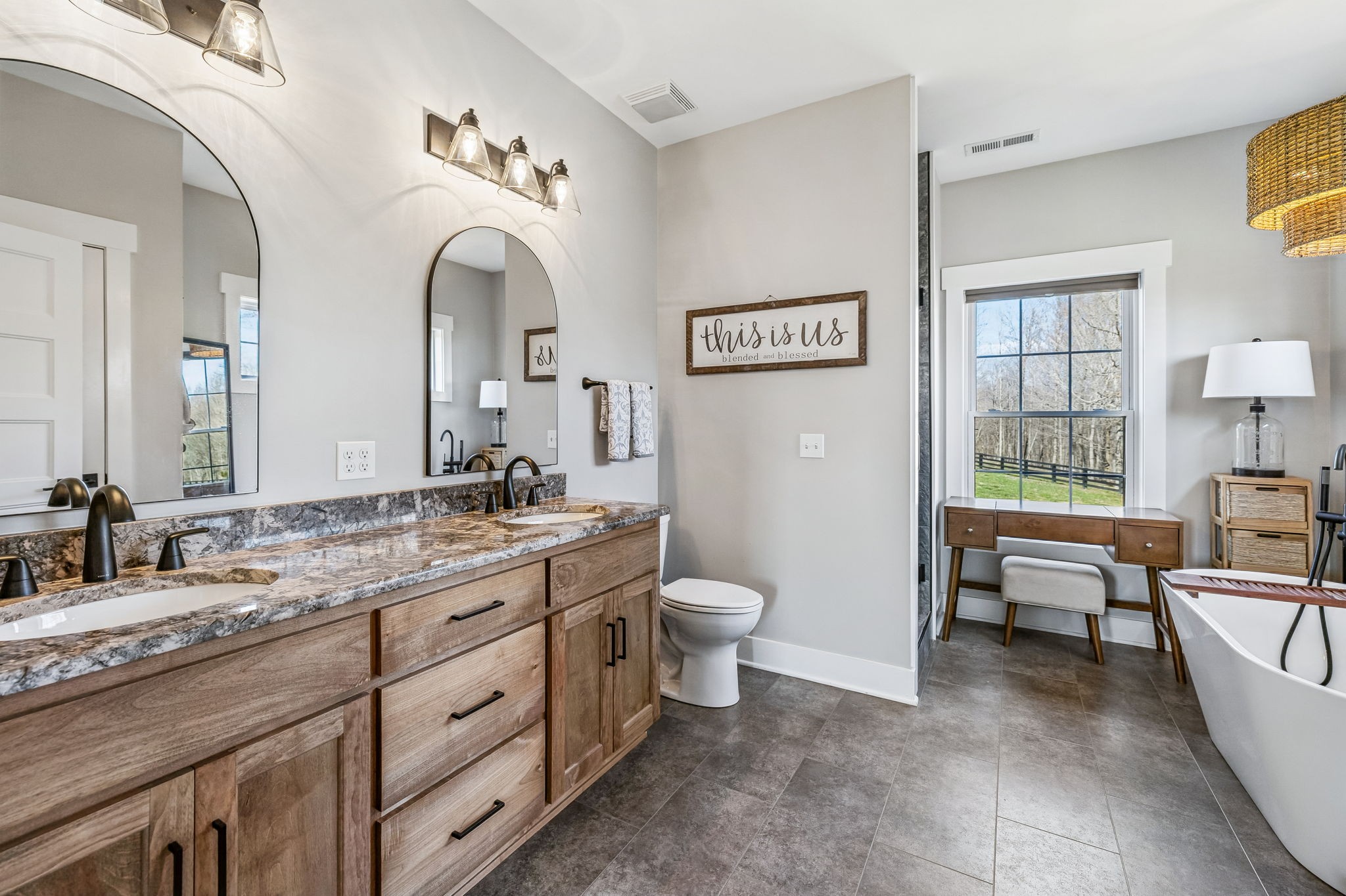 1869 Taurus Farm Road Lafayette, TN 37083 - Photo 32 of 60 a spacious bathroom with a granite countertop sink a toilet and a bathtub