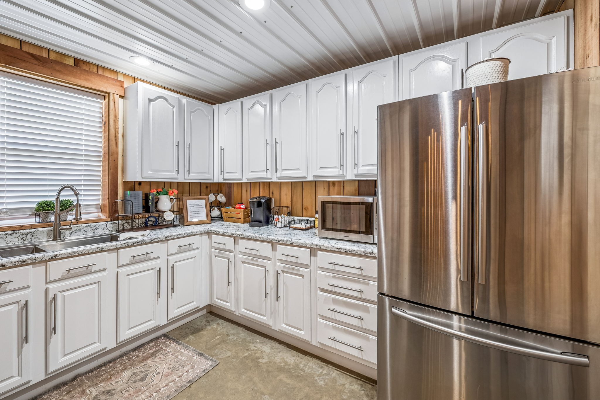 1869 Taurus Farm Road Lafayette, TN 37083 - Photo 42 of 60 a kitchen with stainless steel appliances granite countertop a refrigerator sink and cabinets