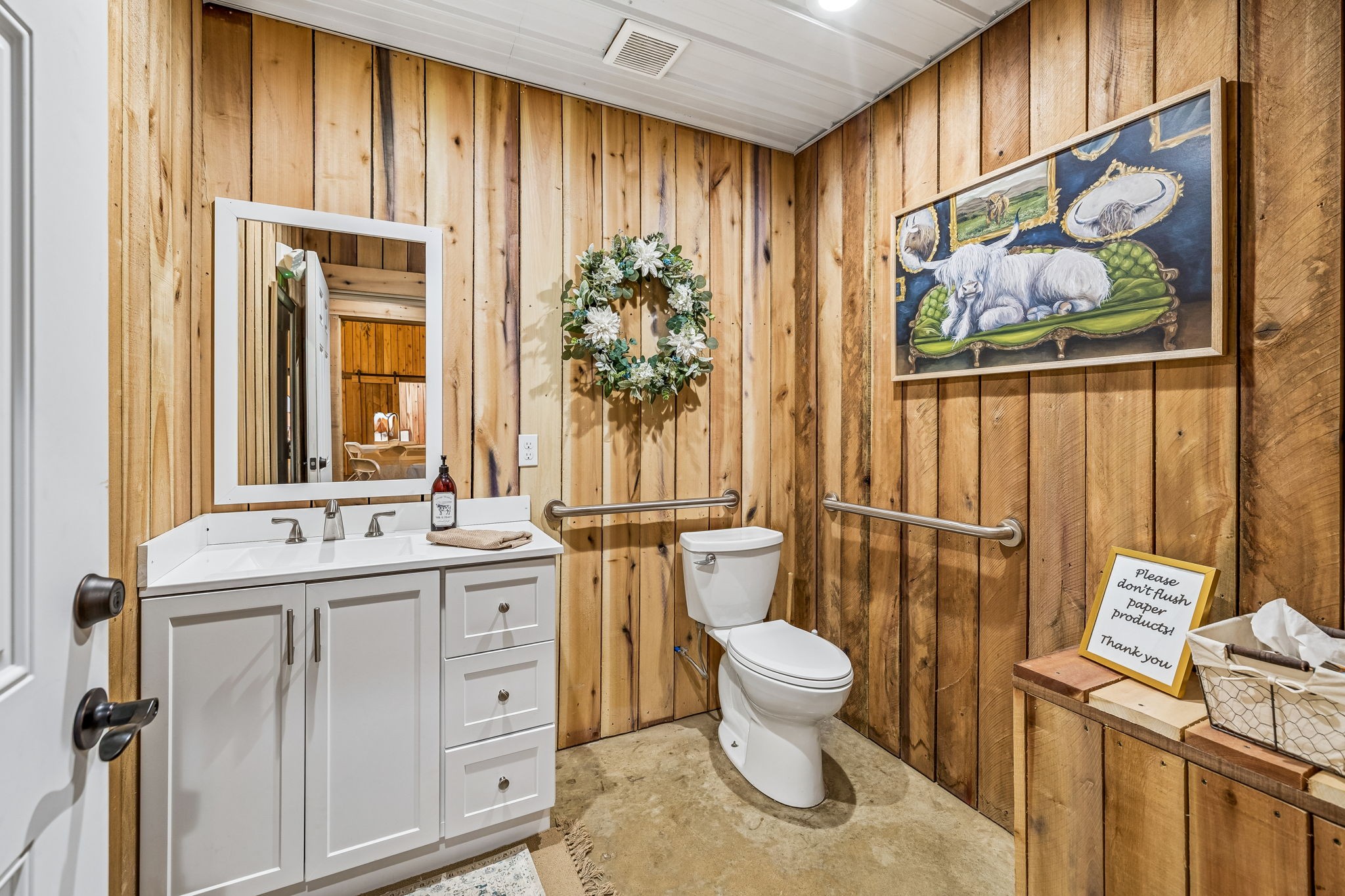 1869 Taurus Farm Road Lafayette, TN 37083 - Photo 43 of 60 a bathroom with a toilet sink and mirror