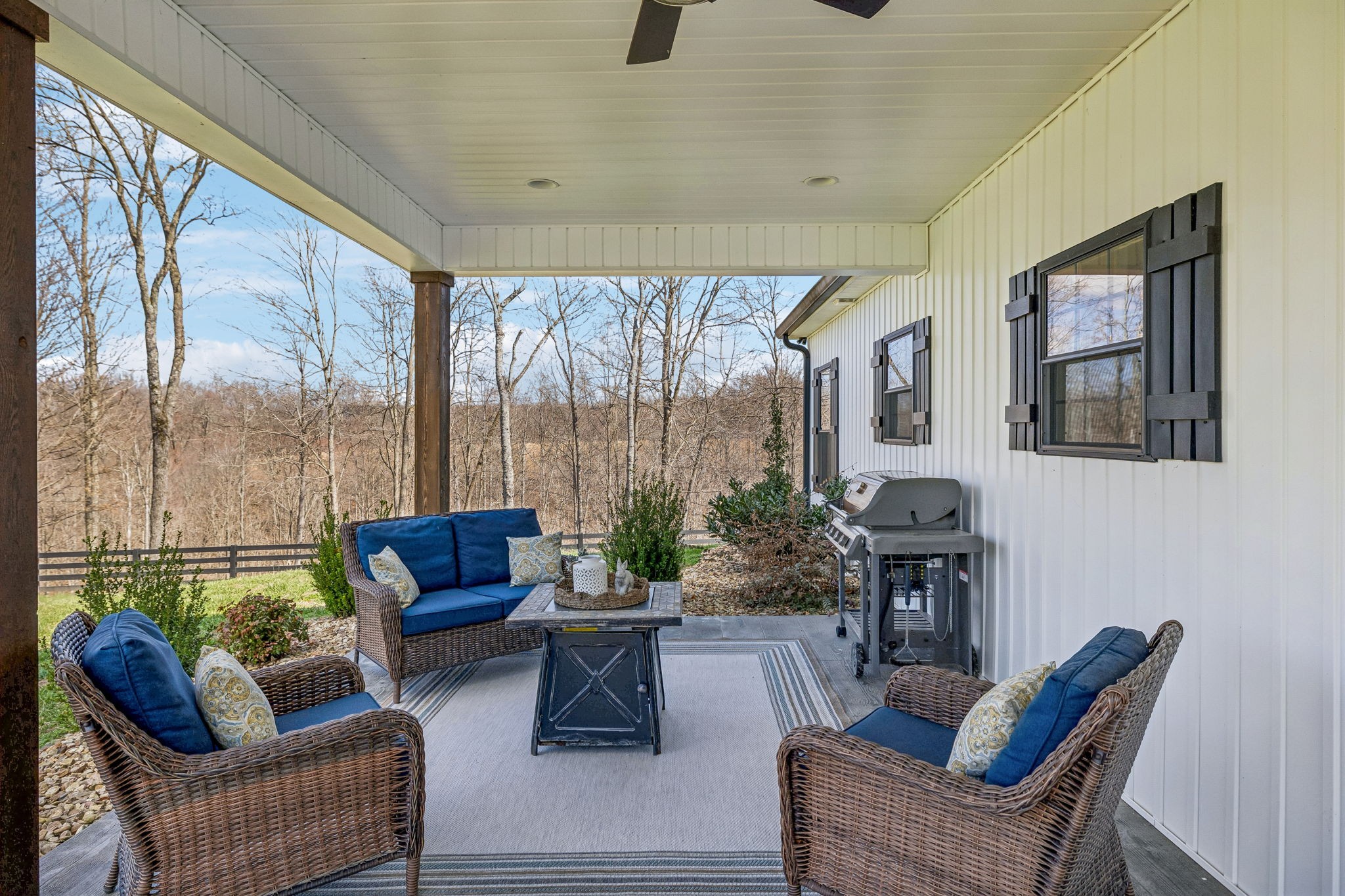 1869 Taurus Farm Road Lafayette, TN 37083 - Photo 48 of 60 a living room with furniture and a floor to ceiling window