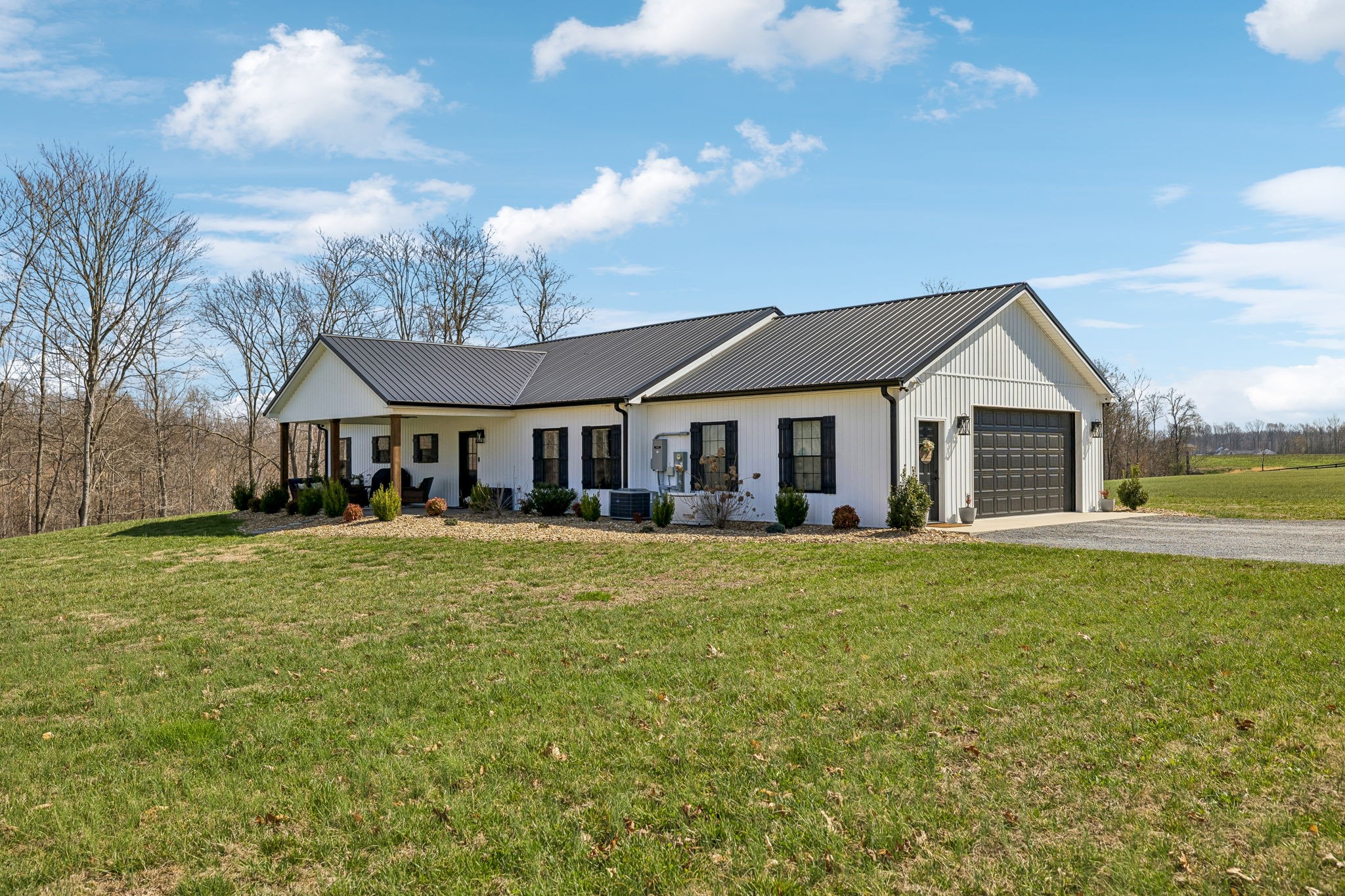 1869 Taurus Farm Road Lafayette, TN 37083 - Photo 5 of 60 a front view of a house with yard and green space
