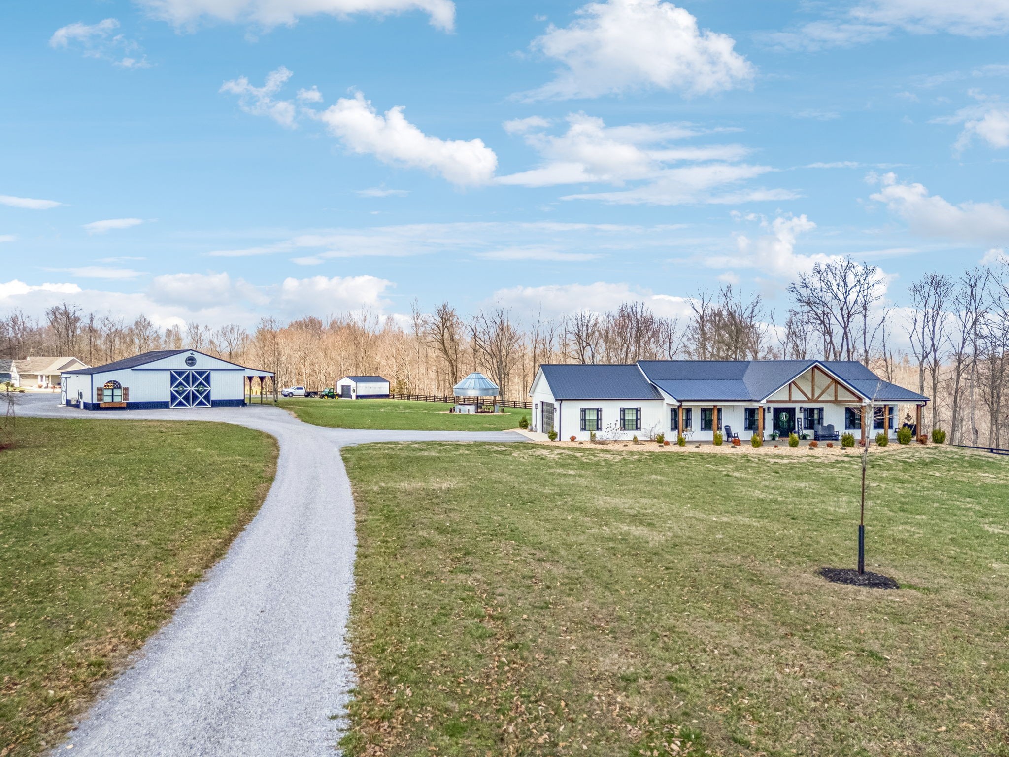 1869 Taurus Farm Road Lafayette, TN 37083 - Photo 55 of 60 a view of a house with a big yard and a fountain