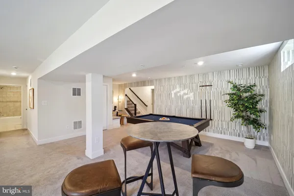 a room with furniture and a potted plant