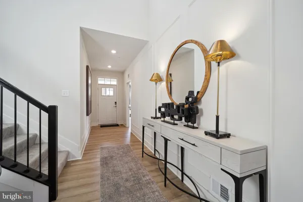 a view of living room with mirror and furniture