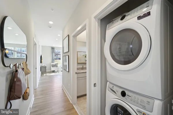 a view of a hallway with washer and dryer