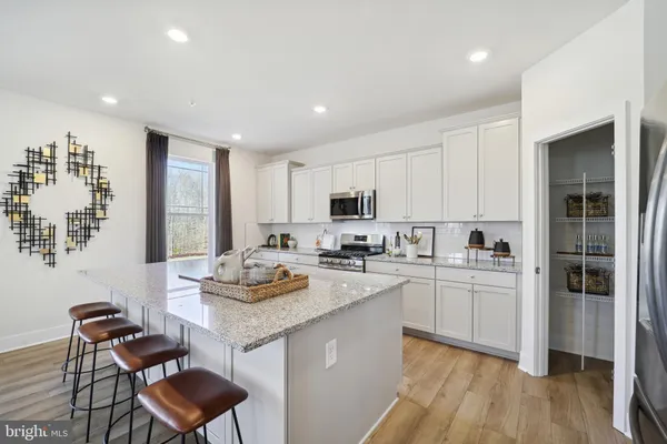 a kitchen with a sink stove and refrigerator