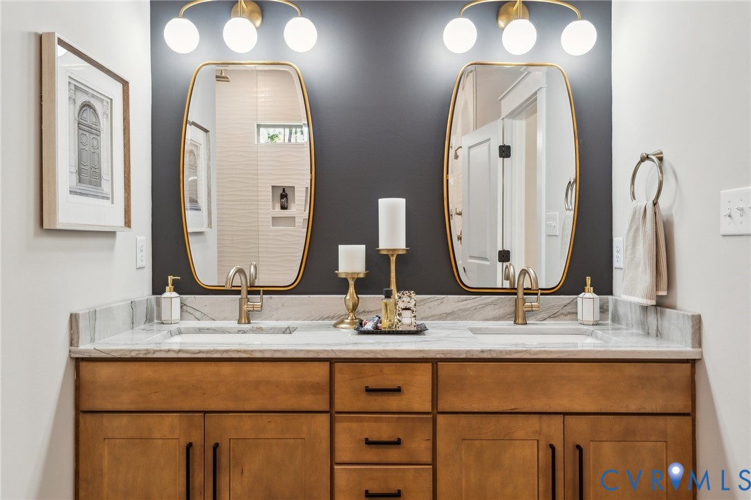 3936 Robins Ridge Drive Moseley, VA 23120 - Photo 11 of 24 a bathroom with double vanity sinks and two mirror