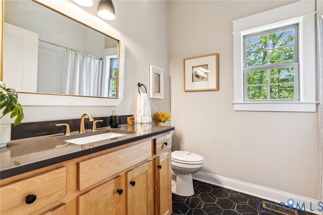 3936 Robins Ridge Drive Moseley, VA 23120 - Photo 16 of 24 a bathroom with a granite countertop sink toilet and a mirror