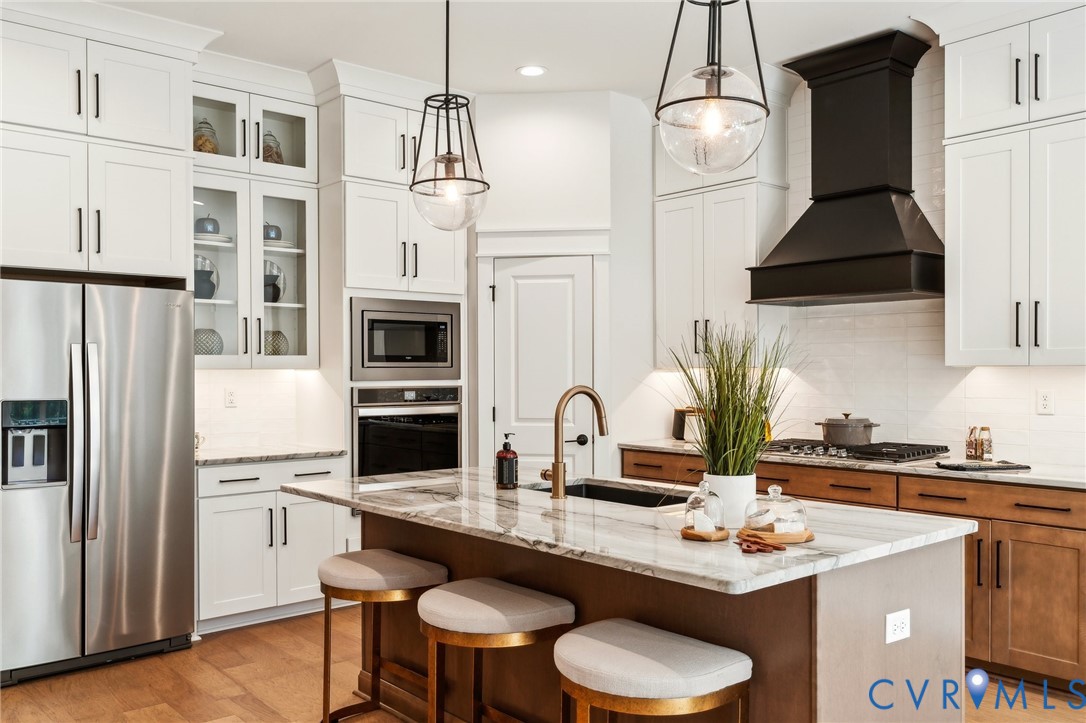 3936 Robins Ridge Drive Moseley, VA 23120 - Photo 2 of 24 a kitchen with stainless steel appliances a sink a stove a refrigerator and cabinets