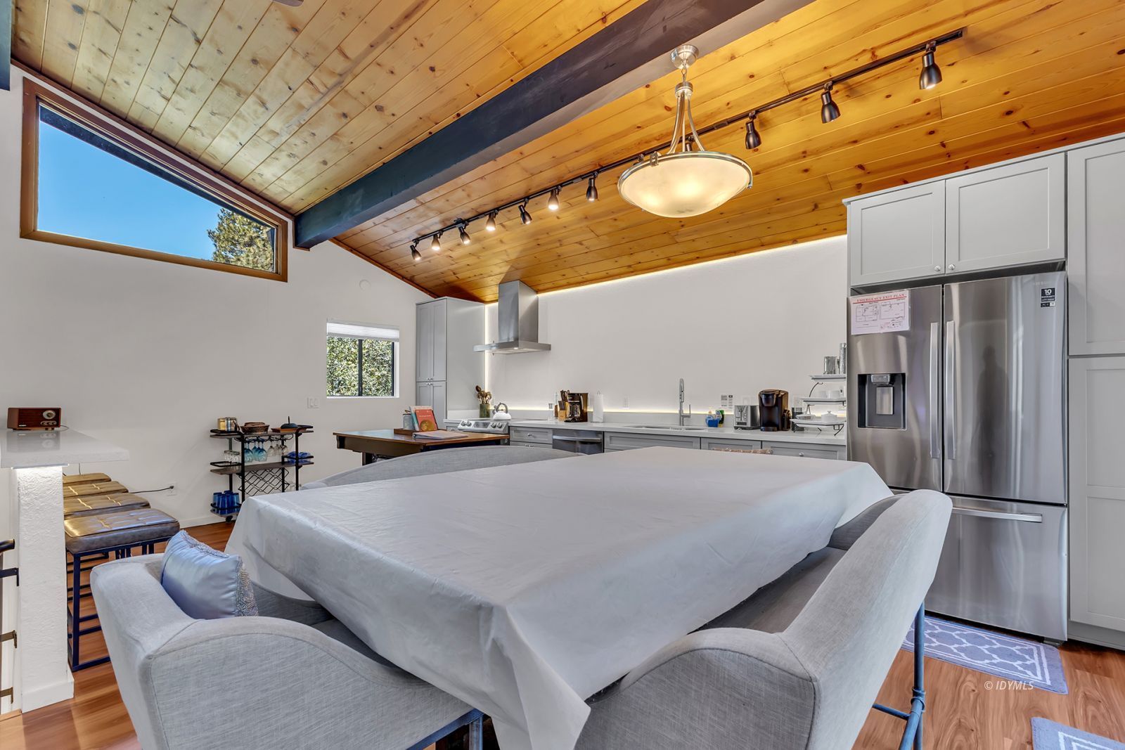 25595 Glen Road Idyllwild, CA 92549 - Photo 21 of 51 a living room with stainless steel appliances furniture a fireplace and a kitchen view