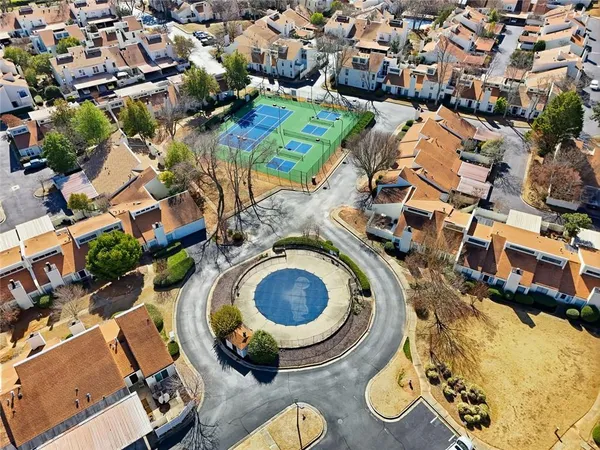 an aerial view of a swimming pool yard and outdoor seating