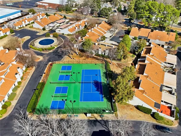 an aerial view of residential house with outdoor space and swimming pool