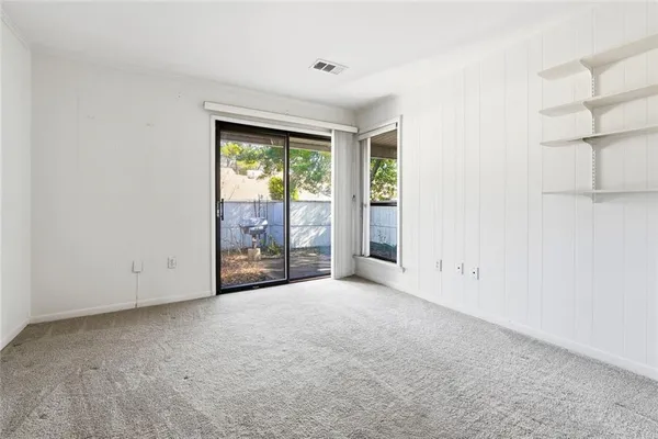 an empty room with windows