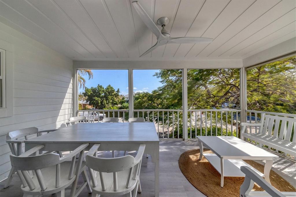 261 Lee Avenue Boca Grande, FL 33921 - Photo 18 of 48 a view of a dining room with furniture window and wooden floor