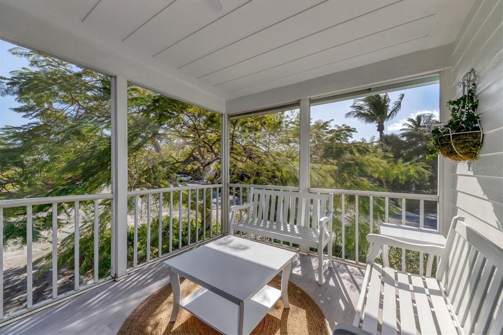 261 Lee Avenue Boca Grande, FL 33921 - Photo 19 of 48 a view of a balcony with wooden floor