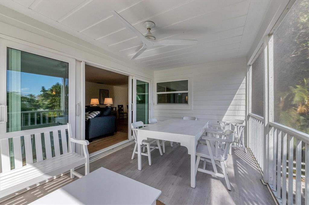 261 Lee Avenue Boca Grande, FL 33921 - Photo 20 of 48 a view of a dining room with furniture window and wooden floor