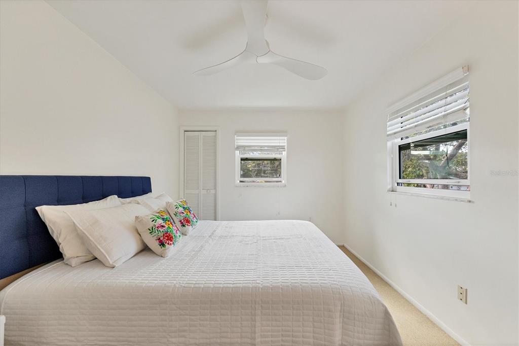 261 Lee Avenue Boca Grande, FL 33921 - Photo 24 of 48 a large white bed in a white room
