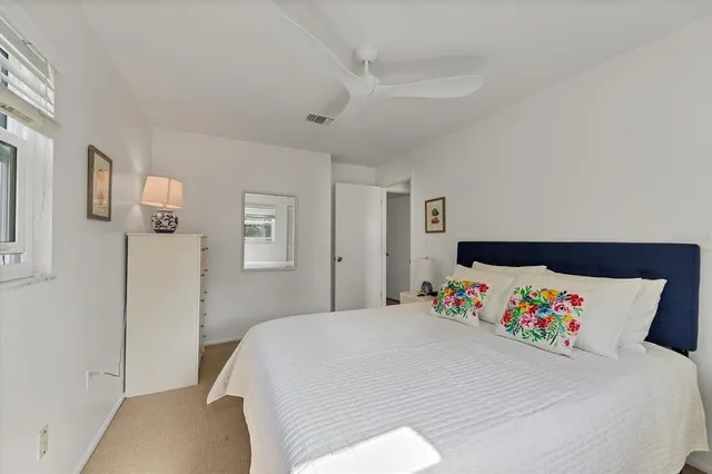 a bedroom with a bed and a cabinets