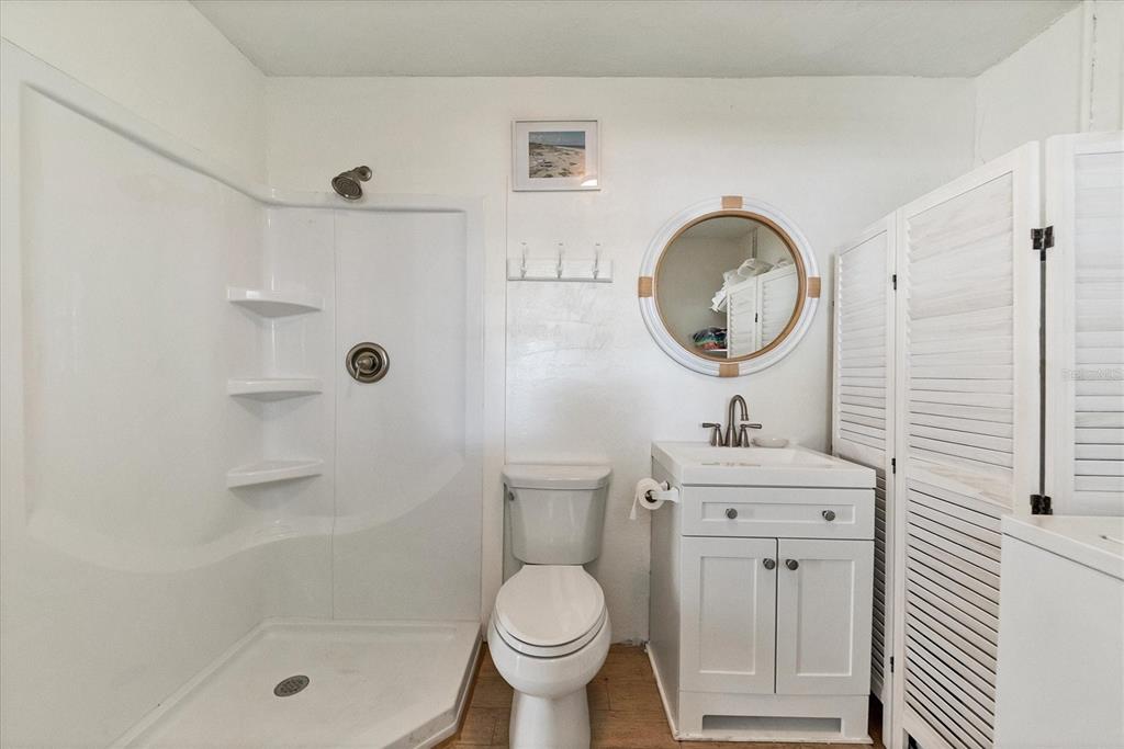 261 Lee Avenue Boca Grande, FL 33921 - Photo 31 of 48 a bathroom with a toilet a sink and a shower