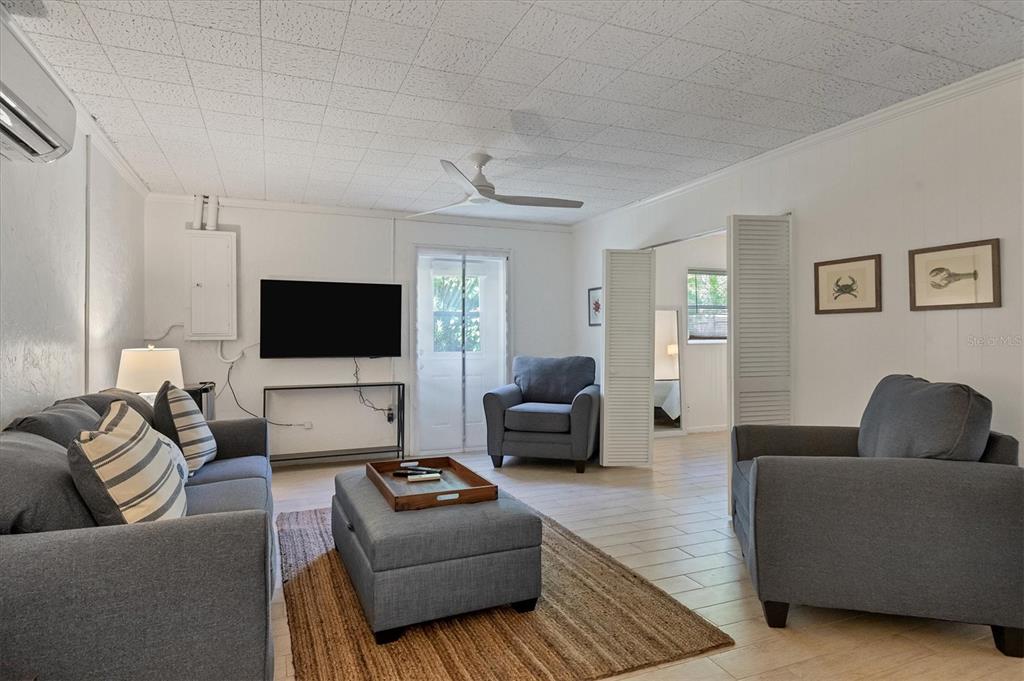 261 Lee Avenue Boca Grande, FL 33921 - Photo 33 of 48 a living room with furniture and a flat screen tv