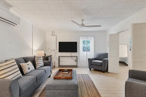 a living room with furniture and a flat screen tv