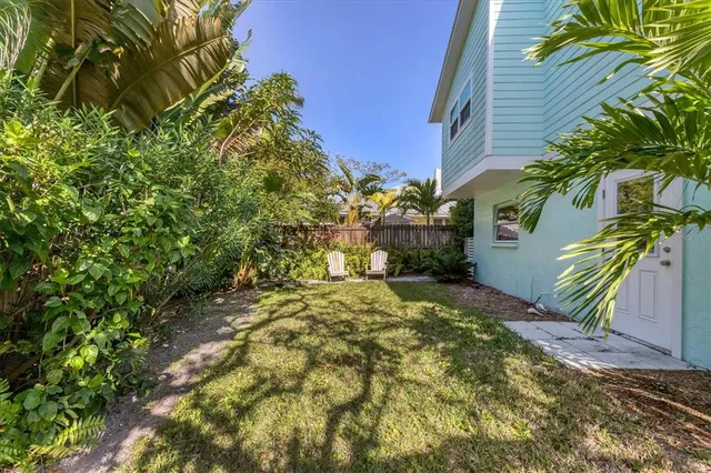 a view of backyard with green space