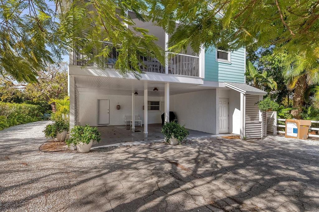 261 Lee Avenue Boca Grande, FL 33921 - Photo 7 of 48 a front view of a house with garden