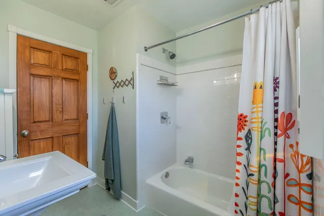 a bathroom with a bathtub and a shower