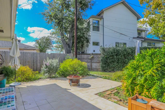 a flower plants with wooden fence