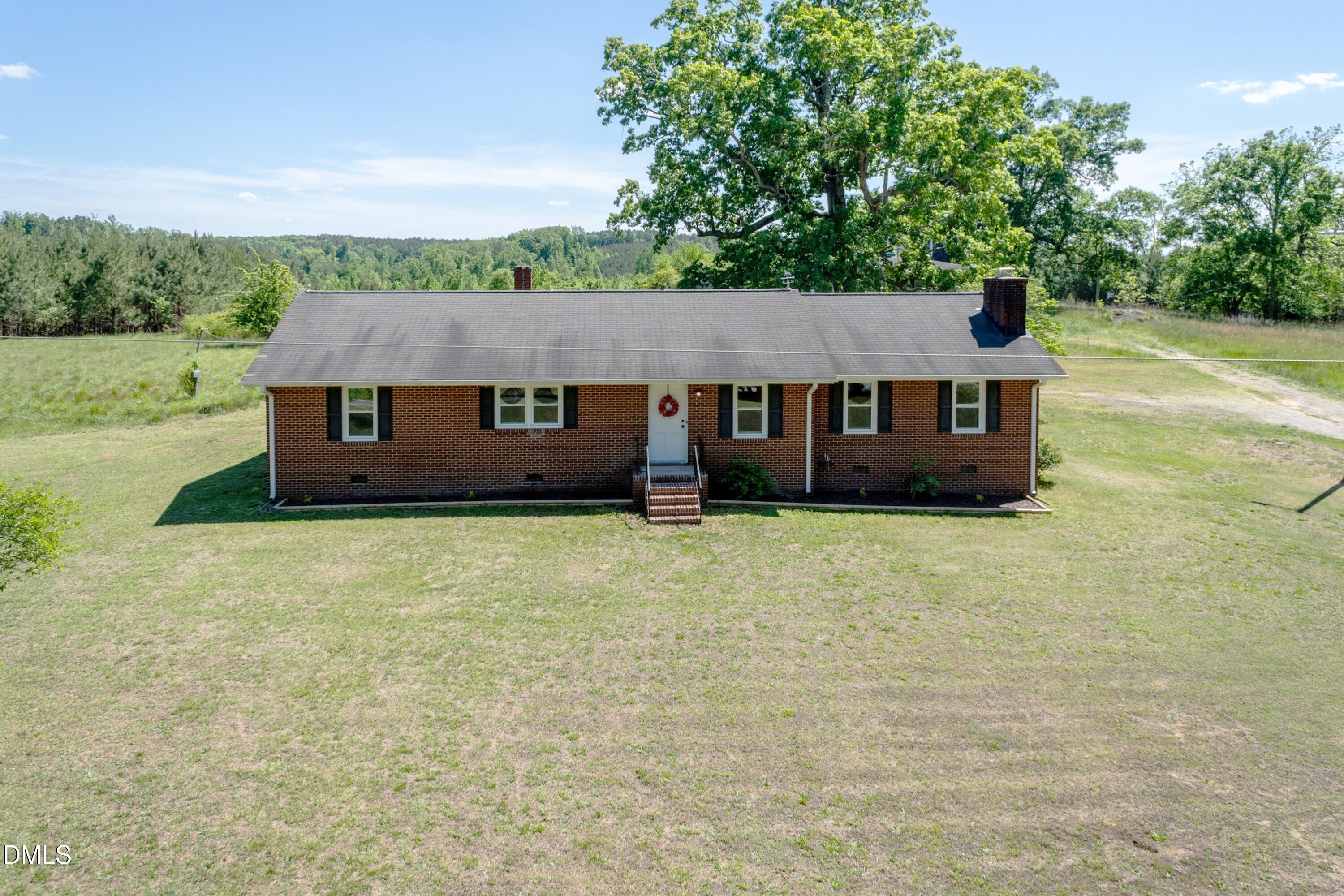 641 Rocky Ford Road Louisburg, NC 27549 - Photo 34 of 38 a front view of a house with a garden