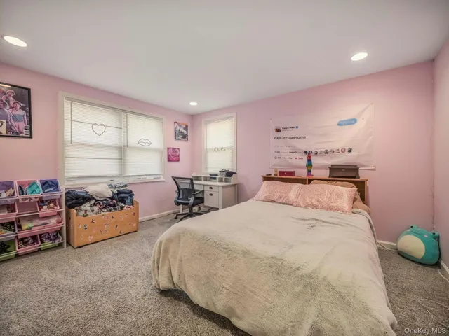 a bed room with two bed and a couch