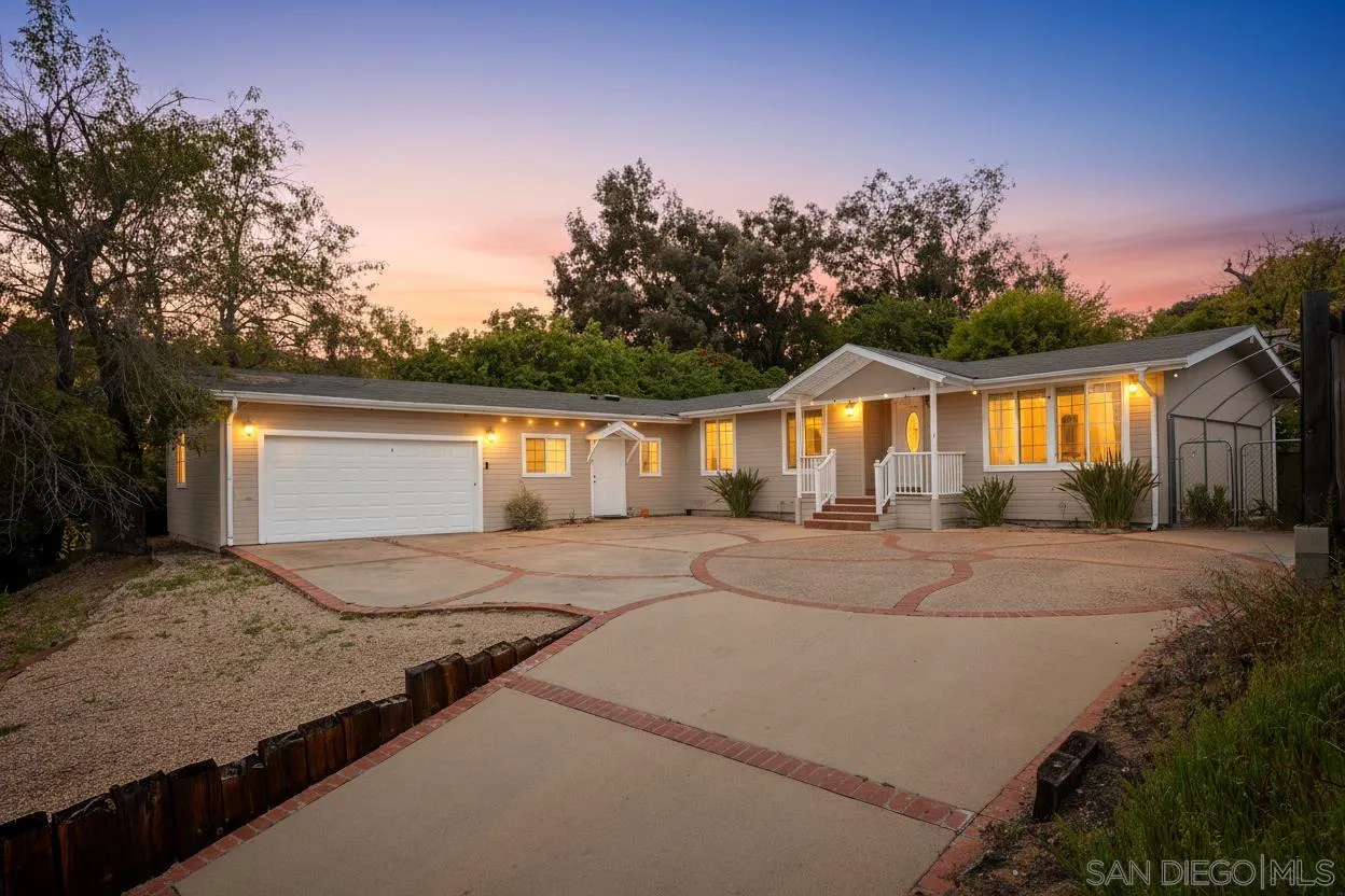 12452 Janet Kay Way El Cajon, CA 92021 - Photo 1 of 30 a view of house with backyard and bushes