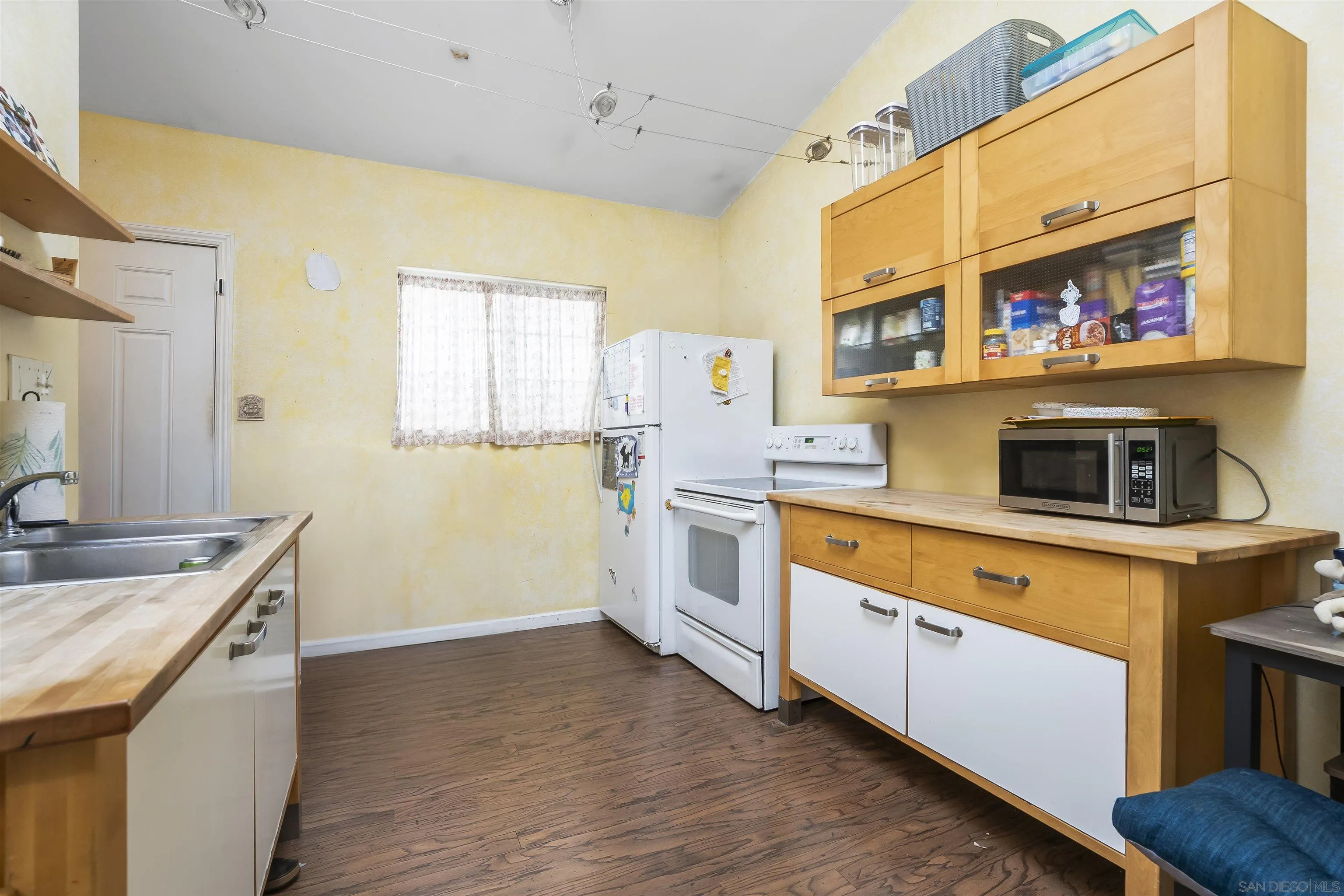 12452 Janet Kay Way El Cajon, CA 92021 - Photo 13 of 30 a kitchen with stainless steel appliances granite countertop a stove and a sink