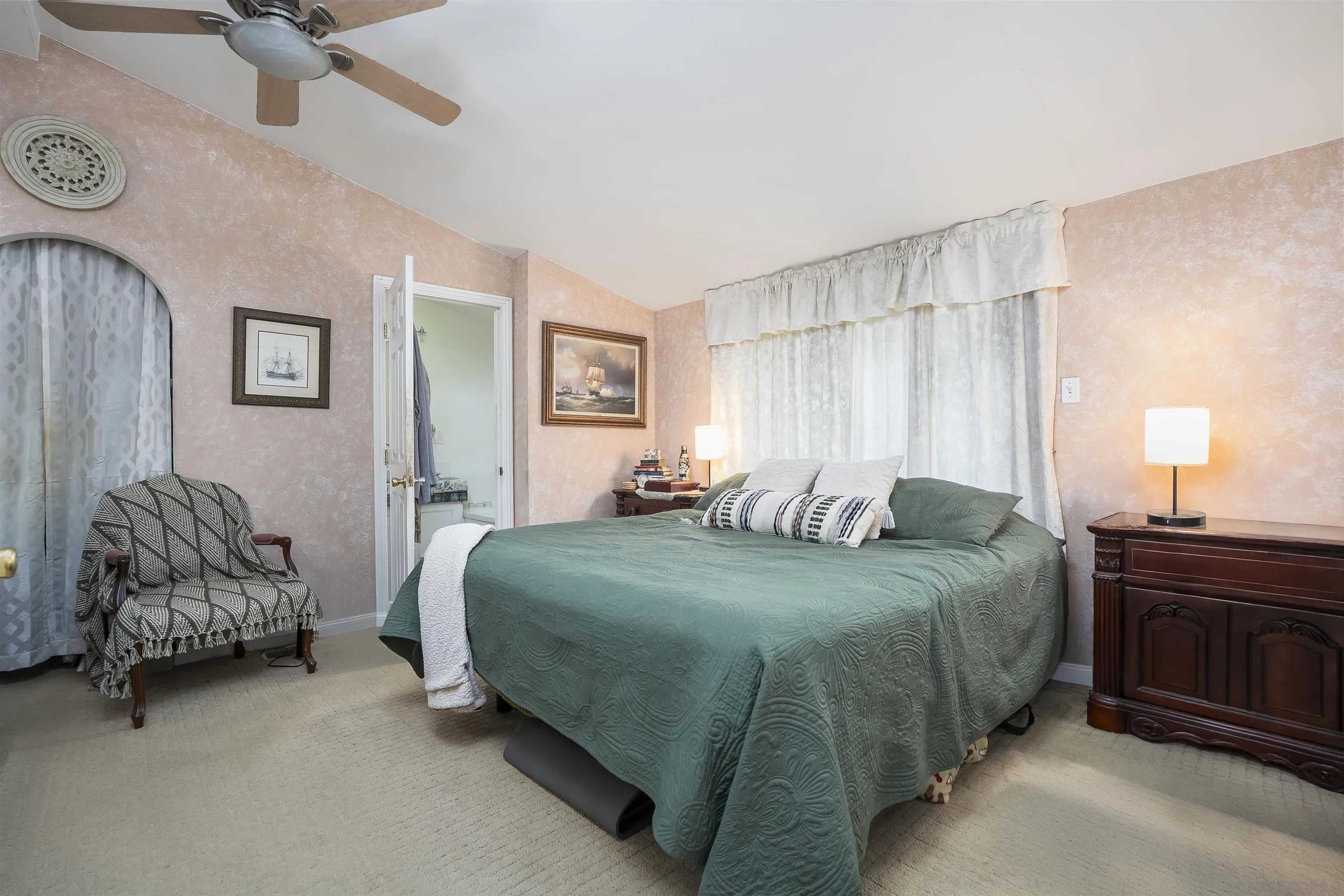12452 Janet Kay Way El Cajon, CA 92021 - Photo 15 of 30 a bedroom with a bed and a chandelier