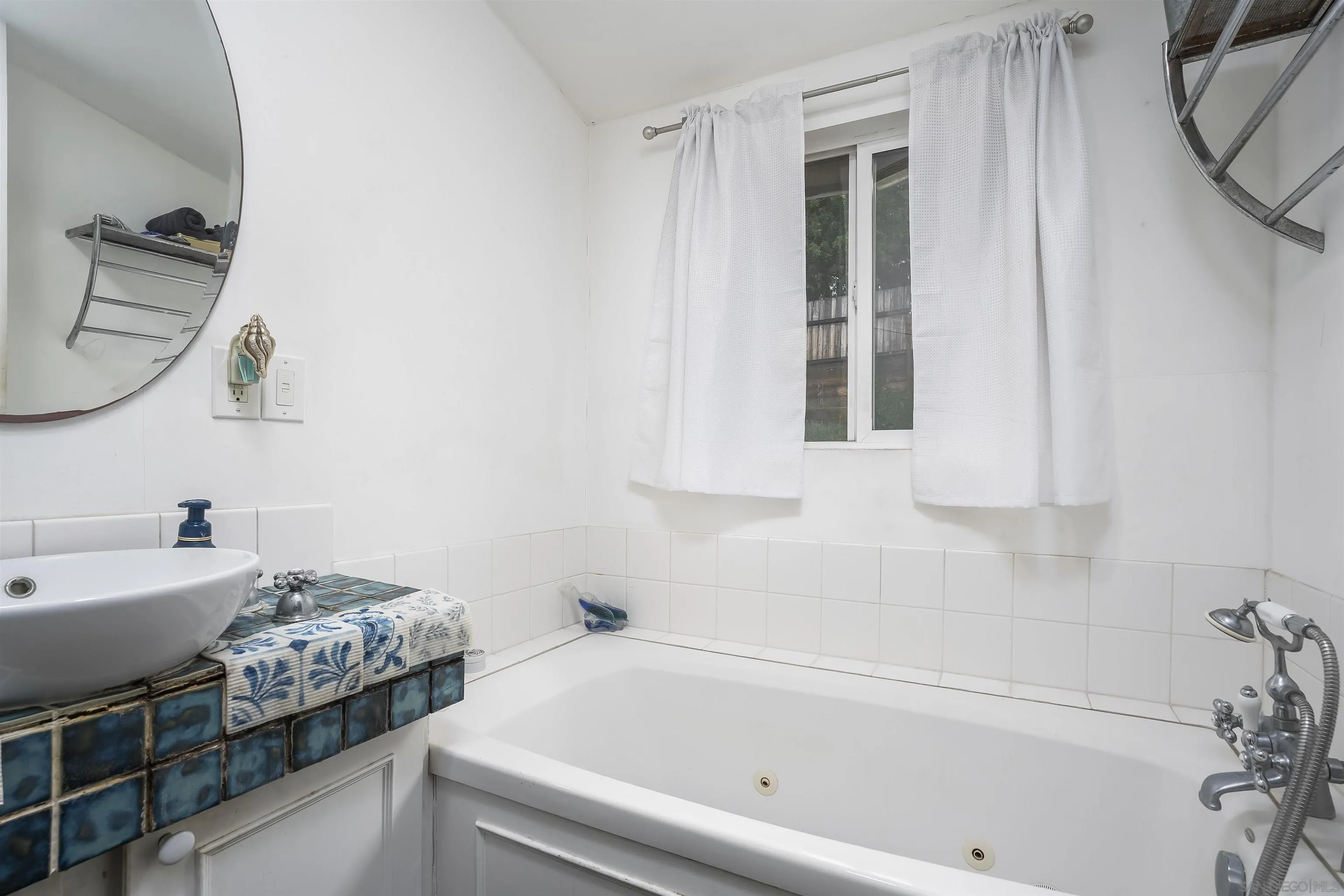 12452 Janet Kay Way El Cajon, CA 92021 - Photo 16 of 30 a bathroom with a bathtub and a sink