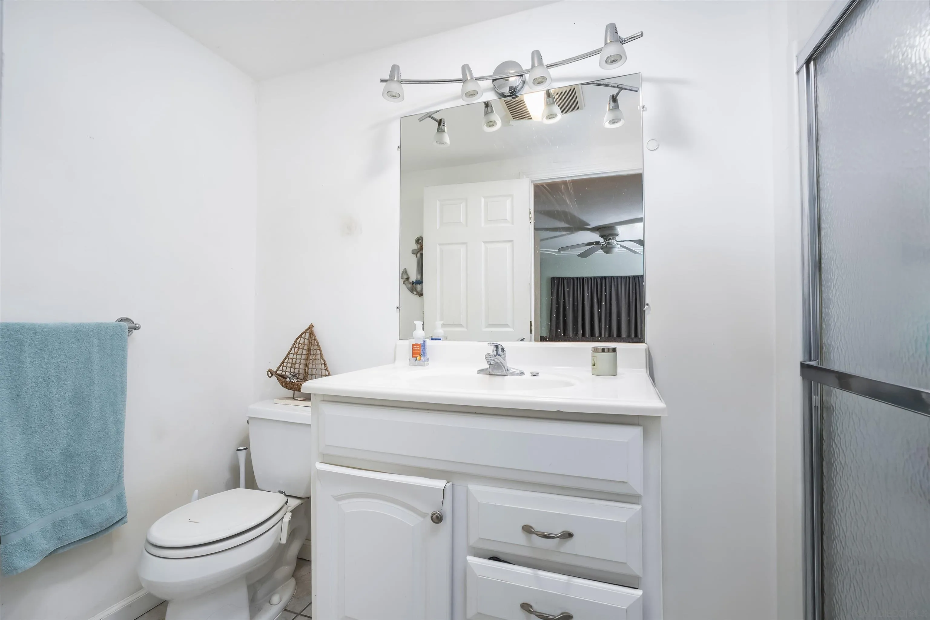 12452 Janet Kay Way El Cajon, CA 92021 - Photo 20 of 30 a bathroom with a sink toilet and mirror