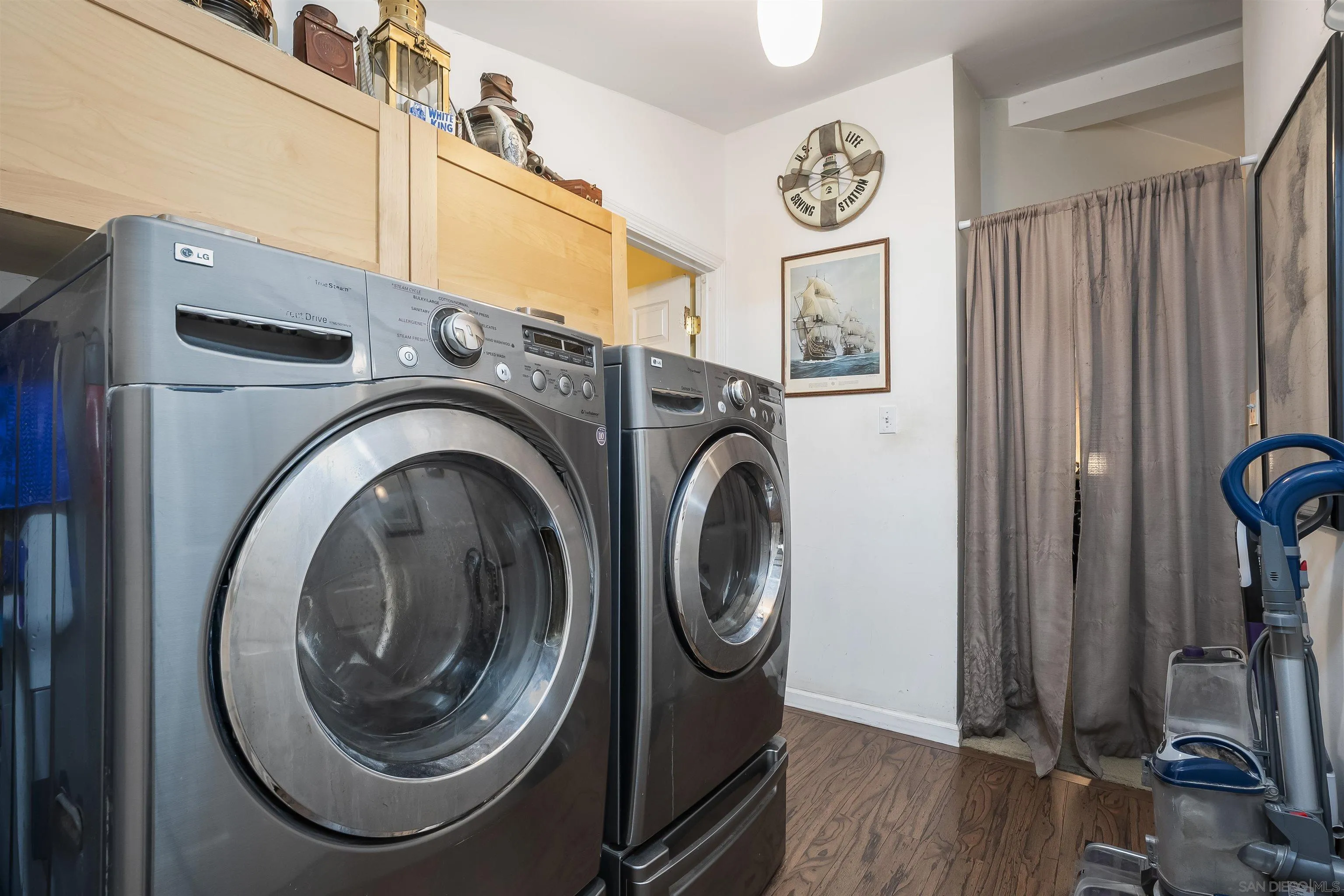 12452 Janet Kay Way El Cajon, CA 92021 - Photo 22 of 30 a view of a hallway with washer and dryer