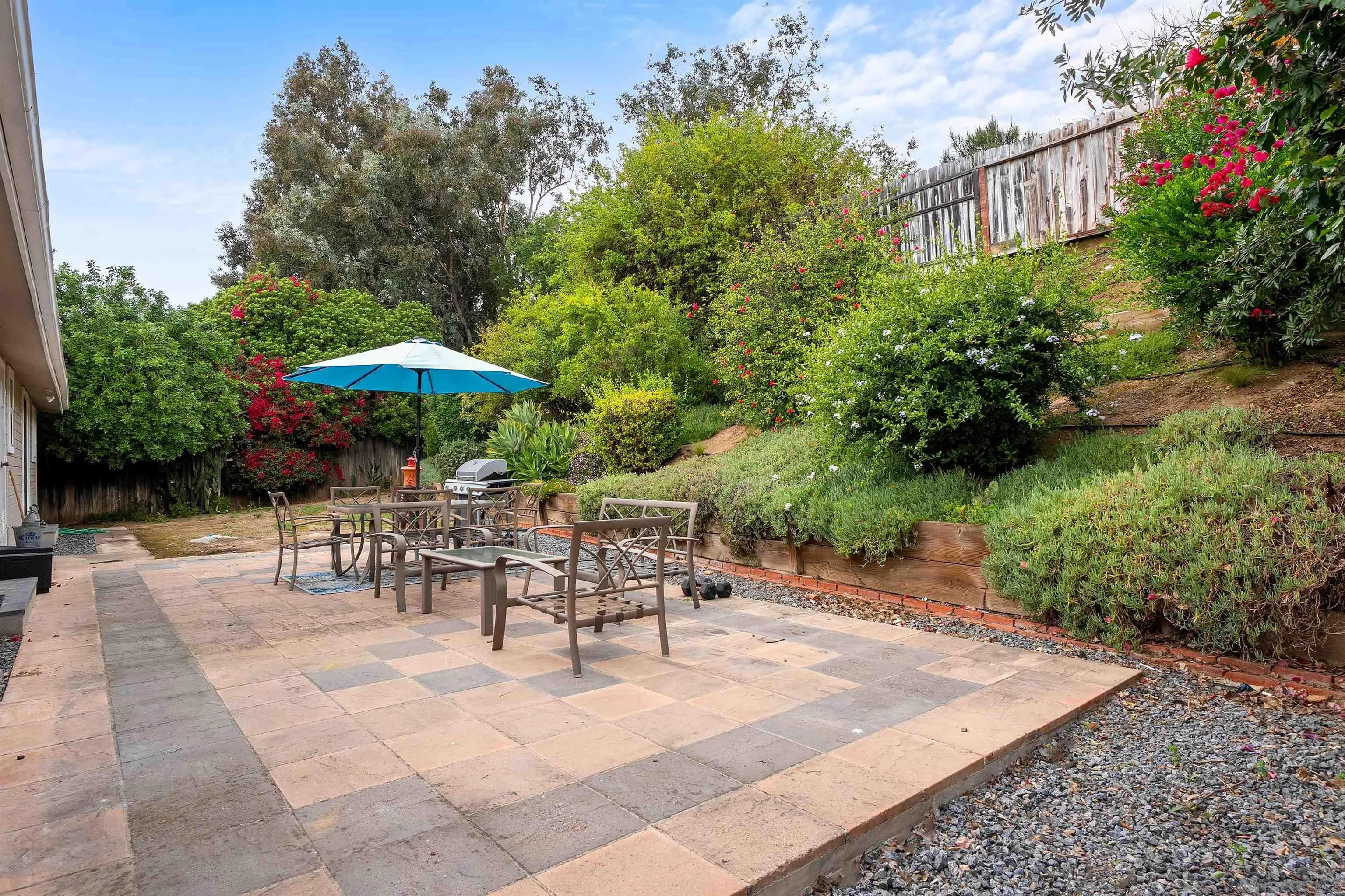 12452 Janet Kay Way El Cajon, CA 92021 - Photo 26 of 30 a view of a patio with a table and chairs under an umbrella