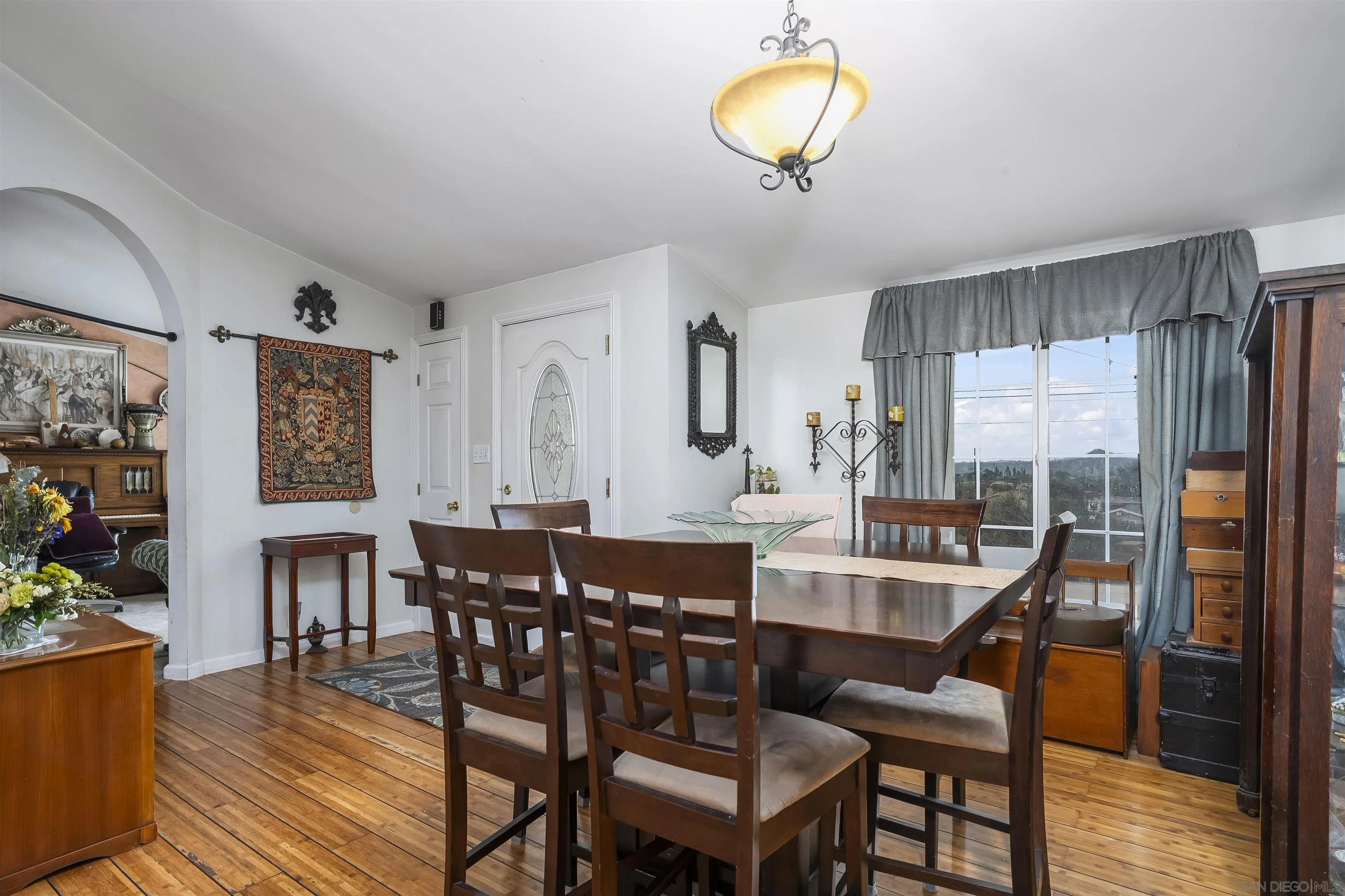 12452 Janet Kay Way El Cajon, CA 92021 - Photo 5 of 30 a view of a dining room with furniture and wooden floor