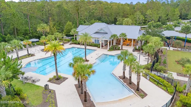 a view of a swimming pool with a yard