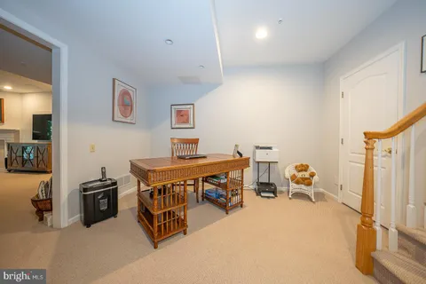 a reading room with furniture and a view of bathroom