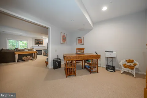 a view of a livingroom with furniture and a workspace